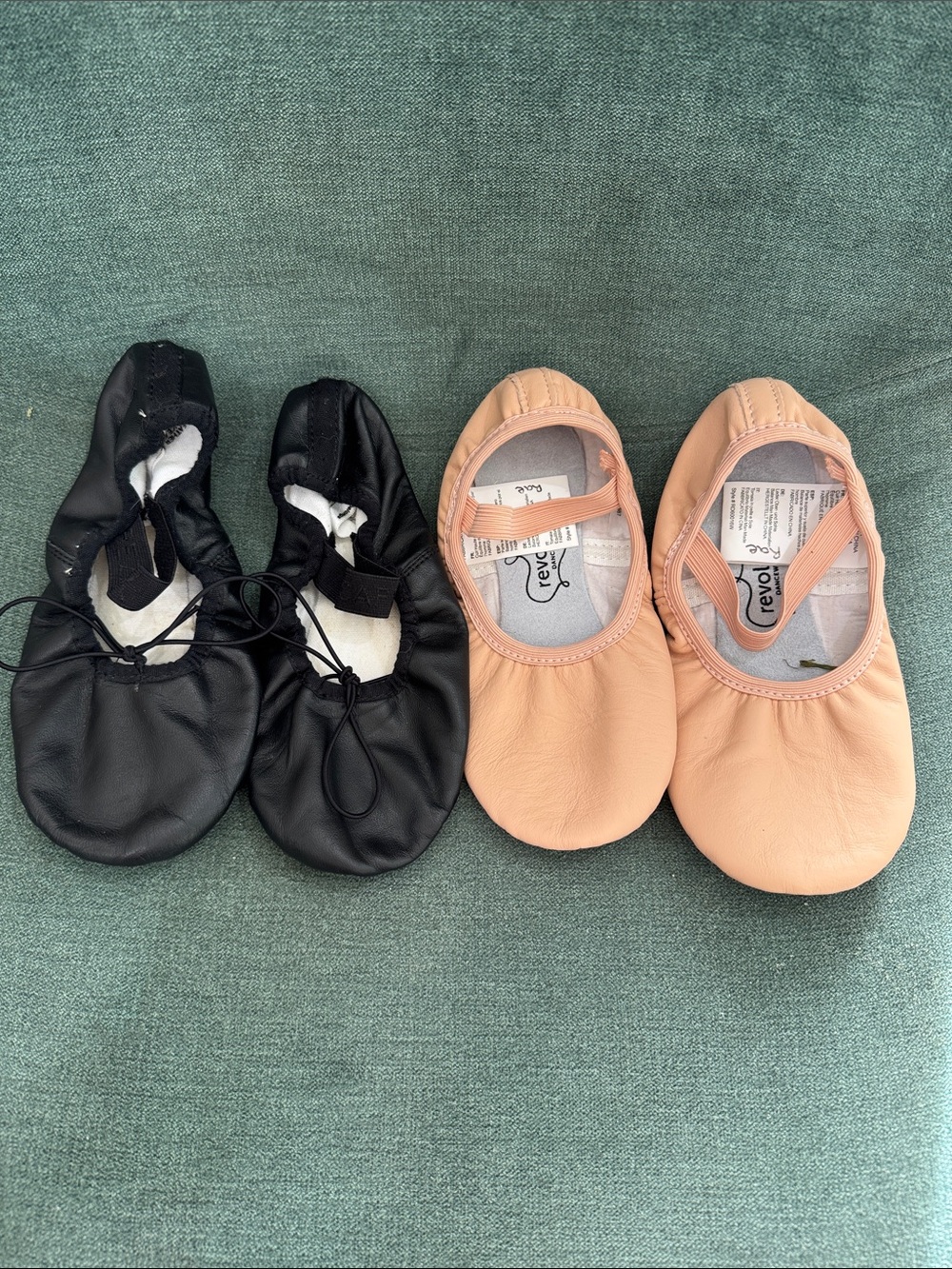 Two pair of youth ballet slippers - Capezio and Revolution. Fits size 1.5.